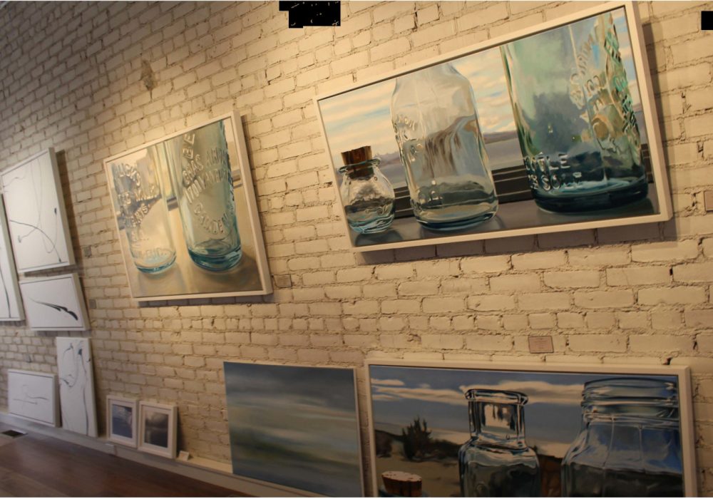 Exhibit of paintings on wall