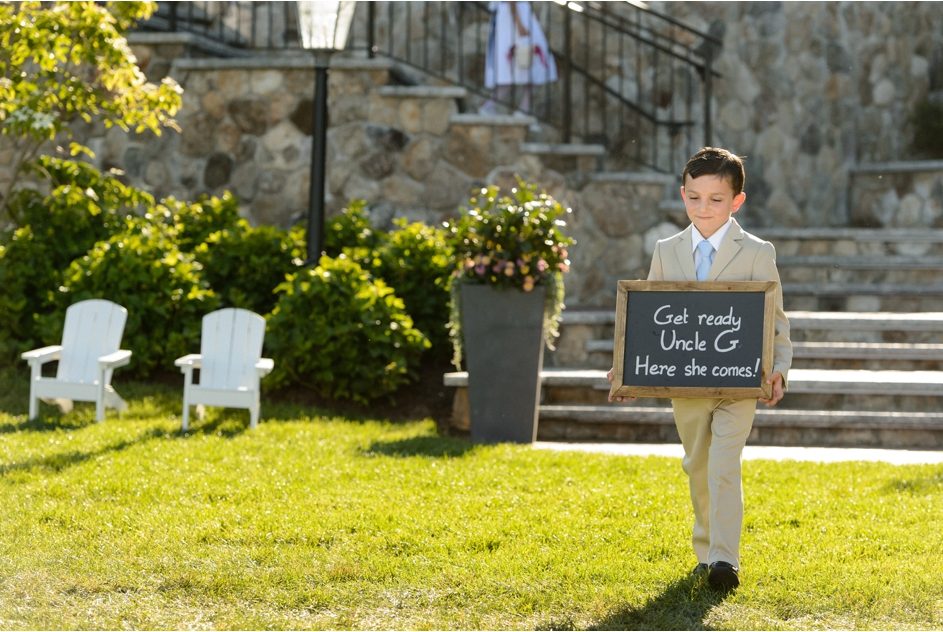 Boy holding sign for wedding