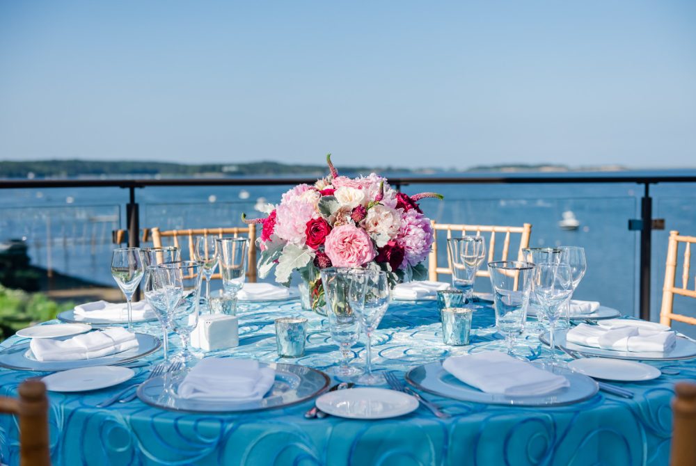 Table set for wedding with pleasant bay in background