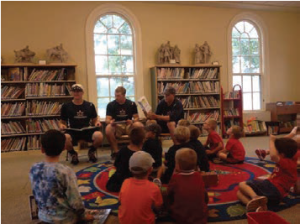 Harwich Mariners reading to children at library